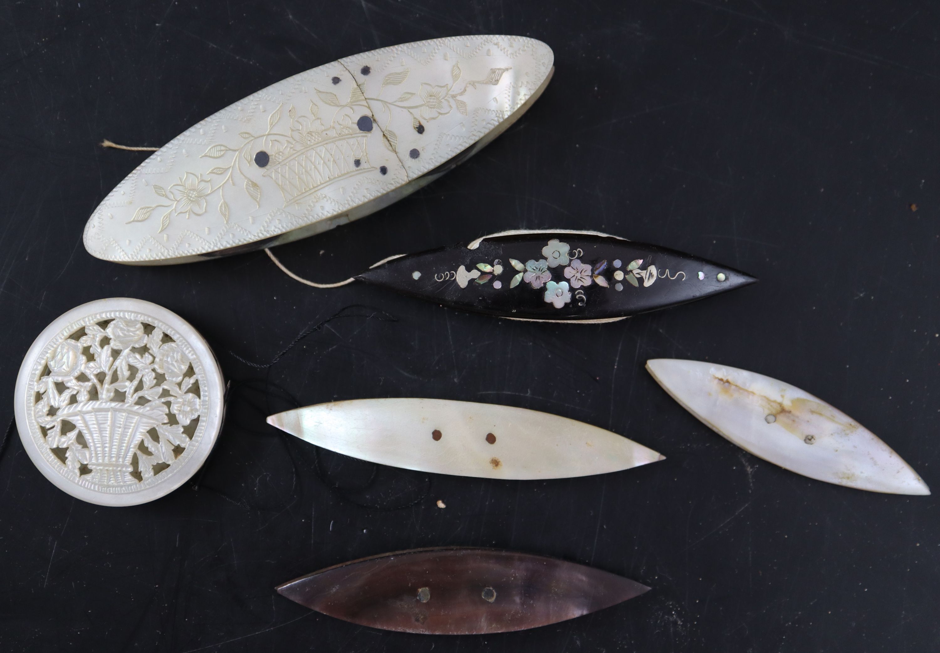 Eighteen assorted early to mid 19th century silk winders largest 9cm